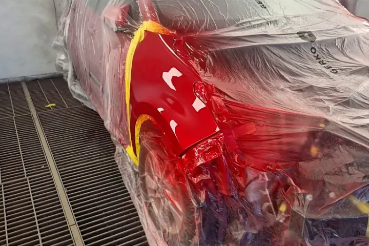 Red front wing after painting at NG Crash Repairs, Finglas
