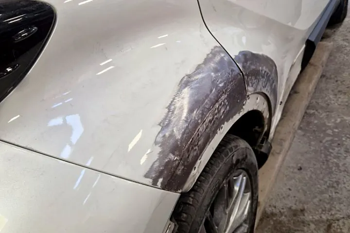 Rear wheel arch damage close-up at NG Crash Repairs, Finglas