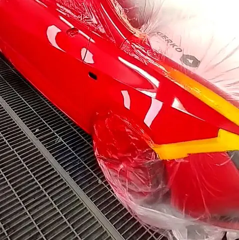 Freshly painted red panels in the spray booth at NG Crash Repairs, Finglas